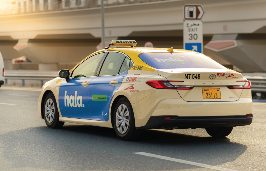 Hala driving into sunset